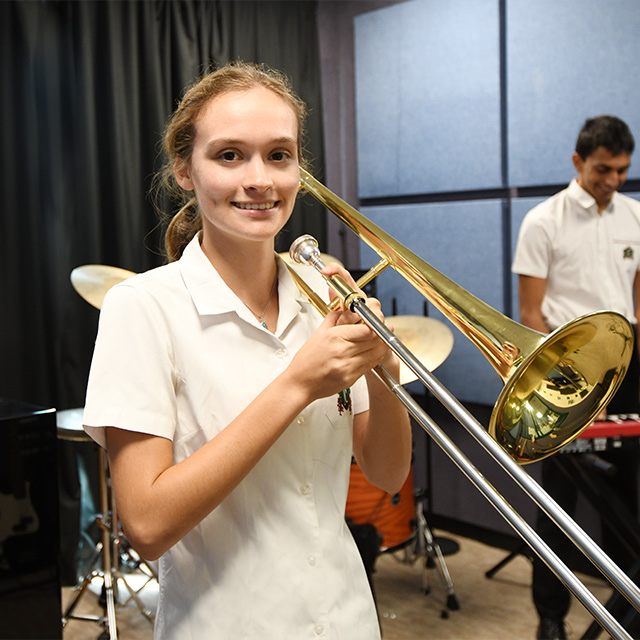 Amber playing the trumpet